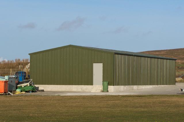 A large green building in the distance
